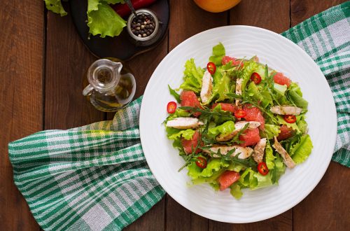 Fresh chicken salad, grapefruit, lettuce and honey mustard dressing. Dietary menu. Proper nutrition. Top view