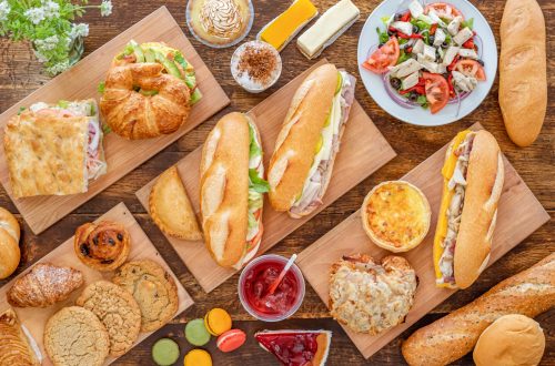 A top view of various tasty dishes on wooden surface